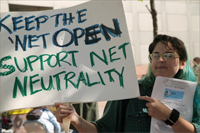 Image: Demonstrator w/Net Neutrality Sign